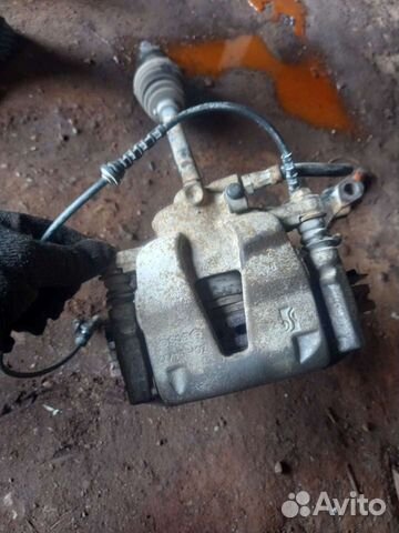 Суппорт тормозной передний левый Opel Corsa D