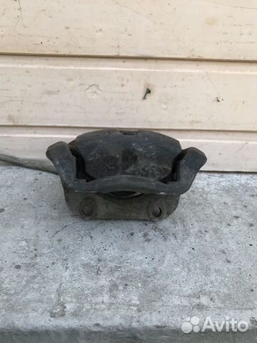 Суппорт передний правый Renault Logan 7701201770